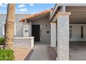 Detailed view of home entrance, featuring a tiled roof and textured columns at 6105 N 12Th Way, Phoenix, AZ 85014