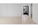 Bright living room with tile entrance and large vertical blinds at 6105 N 12Th Way, Phoenix, AZ 85014