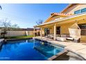 Sparkling pool and covered patio area, perfect for outdoor entertaining and relaxation at 8807 E Dahlia Dr, Scottsdale, AZ 85260