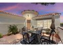 Inviting outdoor patio area with comfortable seating, perfect for relaxing and entertaining at 12860 W Junipero Dr, Sun City West, AZ 85375