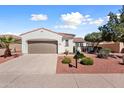 Beautiful one-story home featuring a well-manicured yard and beautiful exterior architecture at 12860 W Junipero Dr, Sun City West, AZ 85375