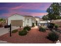 Charming home featuring a well-manicured yard and beautiful exterior architecture at 12860 W Junipero Dr, Sun City West, AZ 85375