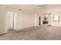 Expansive living room with neutral colors and a ceiling fan, ready for personalization at 1941 S Pierpont Dr # 2141, Mesa, AZ 85206
