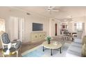 Bright living room featuring neutral colors, a ceiling fan, and seamlessly flowing into a dining area at 1941 S Pierpont Dr # 2141, Mesa, AZ 85206