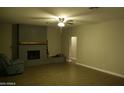 Comfortable living room with brick fireplace, mantel, and a peaceful, relaxing atmosphere at 2215 W Highland Ave, Phoenix, AZ 85015