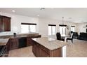 Bright kitchen with granite counters, dark wood cabinets, and breakfast nook at 24113 N 26Th Pl, Phoenix, AZ 85024
