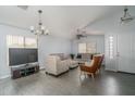 Bright living room with tile floors, neutral walls, and comfortable seating arrangement at 2889 S 161St Dr, Goodyear, AZ 85338