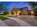 Beautiful home featuring a three-car garage, paved driveway, and well-maintained landscaping at 2950 E Los Altos Ct, Gilbert, AZ 85297