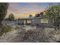 Private backyard featuring a pool, patio, and mature trees, creating a relaxing outdoor space at 3325 N Desoto St, Chandler, AZ 85224
