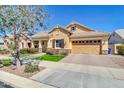 Single-story home with desert landscaping, a covered porch, and a spacious tandem 3-car garage at 4342 E Ronald St, Gilbert, AZ 85295