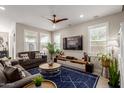 A cozy living room showcasing neutral tones, a large TV, and comfortable seating, perfect for relaxation and entertaining at 4832 S Ferric --, Mesa, AZ 85212