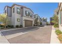 A row of modern two-story homes, each with private garages and well-kept landscaping, creating an inviting streetscape at 4832 S Ferric --, Mesa, AZ 85212