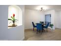 Bright dining room with modern lighting fixture, stylish furniture, and appealing decor elements at 5211 N 24Th St # 104, Phoenix, AZ 85016