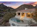 Mountain view home with a private pool, patio, and an elevated vantage point surrounded by desert landscape at 6602 N Arizona Biltmore Cir, Phoenix, AZ 85016