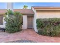 Front exterior view with a beautiful landscaped walkway leading to the decorative front door at 1705 E Juanita Ave, Mesa, AZ 85204