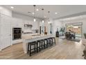 Bright, open-concept kitchen boasts a large island, stainless steel appliances, and seamless flow to the dining area at 24270 N 173Rd Ave, Surprise, AZ 85387