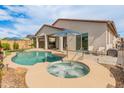 Private backyard oasis with pool, spa, covered patio, and ample space for entertaining in the Arizona sun at 24270 N 173Rd Ave, Surprise, AZ 85387