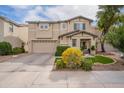 Charming two-story home features a two car garage, fresh landscaping, and cozy covered entryway at 2469 S Sailors Ct, Gilbert, AZ 85295