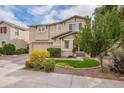 Charming two-story home features a two car garage, fresh landscaping, and cozy covered entryway at 2469 S Sailors Ct, Gilbert, AZ 85295
