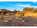The entrance of Anthem Country Club featuring desert landscaping, cacti, and decorative rock at 2550 W Pumpkin Ridge Dr, Anthem, AZ 85086