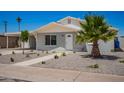 Inviting home exterior with a cozy carport and desert-style landscaping at 2634 N 52Nd Ave, Phoenix, AZ 85035
