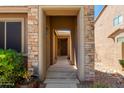 Exterior entrance shows stone facade and sheltered entry to front door at 29374 N 68Th Ln, Peoria, AZ 85383