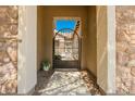 Close up showing a wrought-iron entry gate and stone facade at 3046 E Athena Ave, Gilbert, AZ 85297