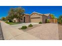 Beautiful single-Gathering house with a brick driveway and a well-manicured lawn at 3046 E Athena Ave, Gilbert, AZ 85297