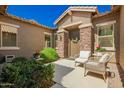 Charming front porch with stone accents and outdoor seating at 3046 E Athena Ave, Gilbert, AZ 85297