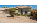Inviting single-story home with landscaped front yard and xeriscaping for low maintenance at 3805 S 73Rd Dr, Phoenix, AZ 85043