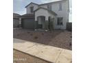 Charming two-story home featuring stucco exterior, gray accent colors, and a well-manicured front yard at 43372 N Wollemi St, Queen Creek, AZ 85140