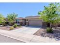 Lovely single-story home with a two-car garage and easy-care desert landscaping at 4557 W South Butte Rd, San Tan Valley, AZ 85144