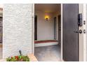 A clean and bright entryway with a security door and tiled accents at 4757 W Caron St, Glendale, AZ 85302