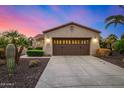 This well-maintained home features a two-car garage, desert landscaping, and a concrete driveway at 13064 W Big Oak St, Peoria, AZ 85383