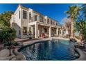 Backyard oasis with a sparkling pool, covered patio, and ample seating for entertaining at 1449 W Commerce Ave, Gilbert, AZ 85233