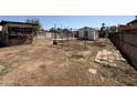 Wide backyard with small sheds offering ample outdoor space at 1918 E Cypress St, Phoenix, AZ 85006