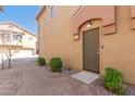 Townhome front door with desert landscaping and a brick paver walkway at 2024 S Baldwin St # 161, Mesa, AZ 85209
