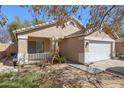 Beige single-story home with a two car garage and desert landscaping at 2847 S 64Th Dr, Phoenix, AZ 85043