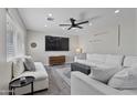 Airy living room offering recessed lighting, modern ceiling fan, and comfortable neutral furnishings at 3516 E Earll Dr, Phoenix, AZ 85018