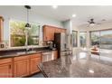 Spacious kitchen featuring granite counters, stainless appliances and ample natural light at 3848 S Coach House Dr, Gilbert, AZ 85297