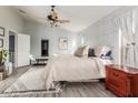 Bright bedroom with a vaulted ceiling, brick accent wall, and neutral decor at 3848 S Coach House Dr, Gilbert, AZ 85297