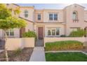 Beautiful townhome exterior with manicured lawn, a gated courtyard and a charming walkway at 4077 S Sabrina Dr # 25, Chandler, AZ 85248