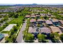 Stunning aerial view of neighborhood featuring manicured lawns, mature trees, and community park at 4167 E Sierra Madre Ave, Gilbert, AZ 85296