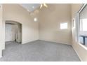 Inviting living room featuring neutral carpeting, high ceilings and lots of natural light at 4234 S 62Nd Ln, Phoenix, AZ 85043