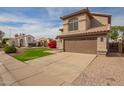 Charming home with a two-car garage, desert landscaping, and a well-maintained lawn in a friendly neighborhood at 4604 E Summerhaven Dr, Phoenix, AZ 85044