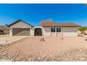 Attractive single-story home boasting a well-maintained front yard with low-maintenance landscaping at 4901 W Augusta Cir, Glendale, AZ 85308