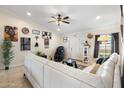 Bright living room featuring a modern white sofa, massage chair, and decorative accents at 5115 W Kings Ave, Glendale, AZ 85306