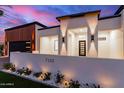 Contemporary home featuring a gated entry, modern design, and lush landscaping at 7325 E Virginia Ave, Scottsdale, AZ 85257