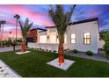 Landscaped front yard with palm trees accents this stylish, modern home at 7325 E Virginia Ave, Scottsdale, AZ 85257