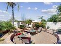 Desert landscaped backyard featuring a stone-paved seating area with comfortable patio furniture at 7705 E Doubletree Ranch Rd # 36, Scottsdale, AZ 85258